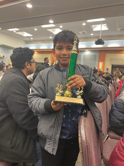 Boy Holding Trophy